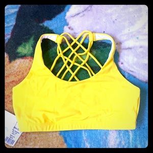 Yellow strappy back sports/yoga bra